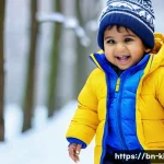 Home 22 키즈 패딩 브랜드 신제품 - A cheerful Bengali toddler wearing a brightly colored lightweight padded jacket in blue and yellow, ...